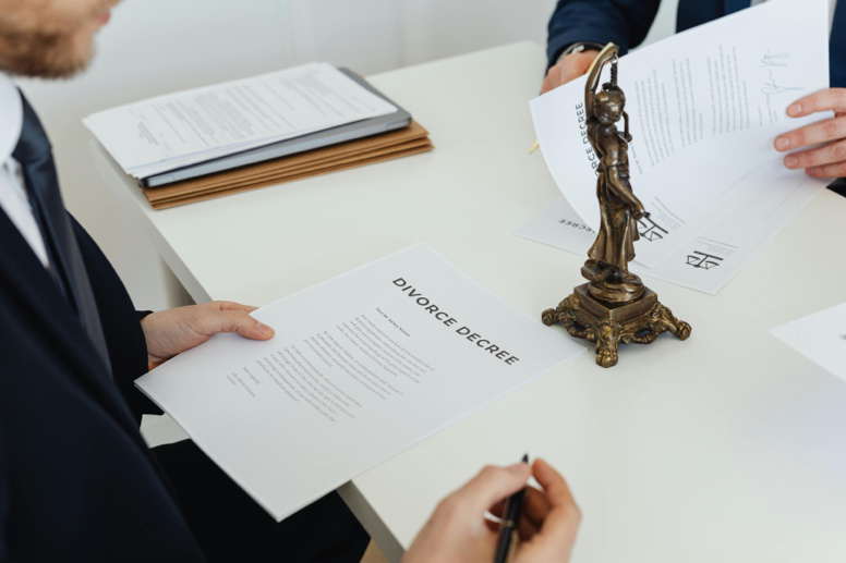 Divorce attorney reviewing legal documents and court strategy with a client in Houston