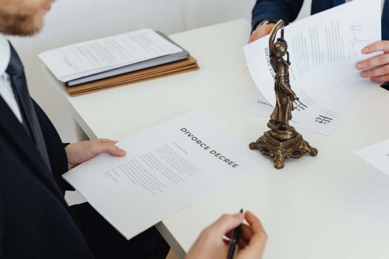 close-up of a man signing divorce papers