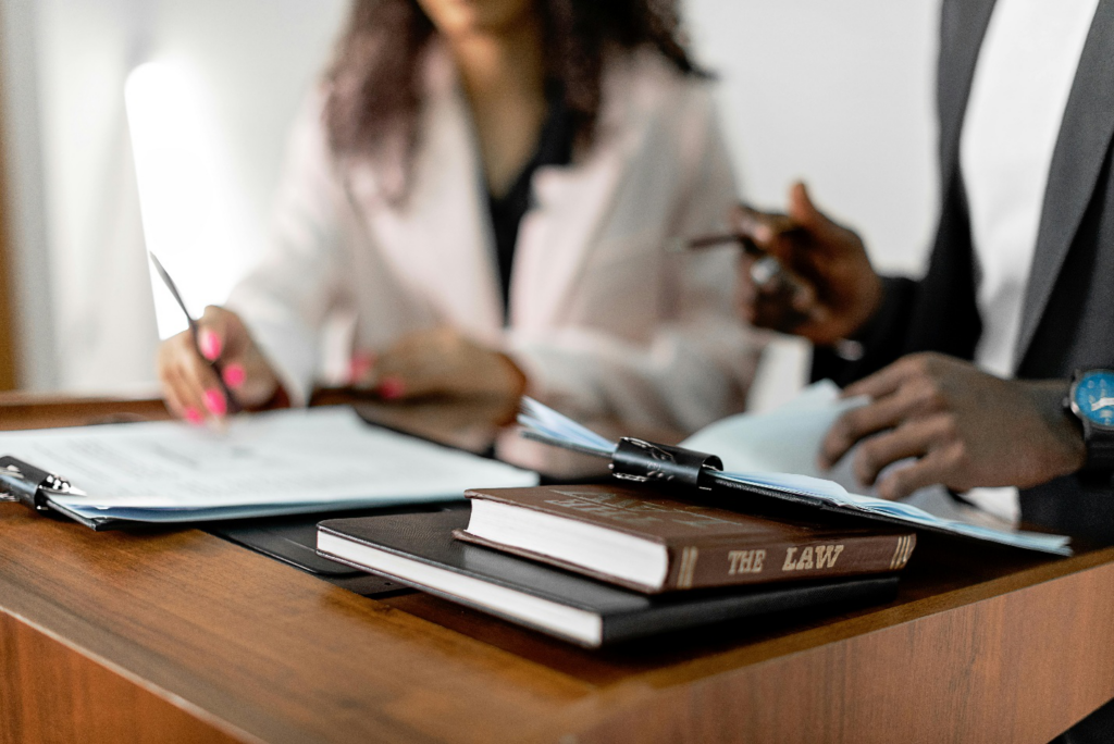 A lawyer discussing documents with a client