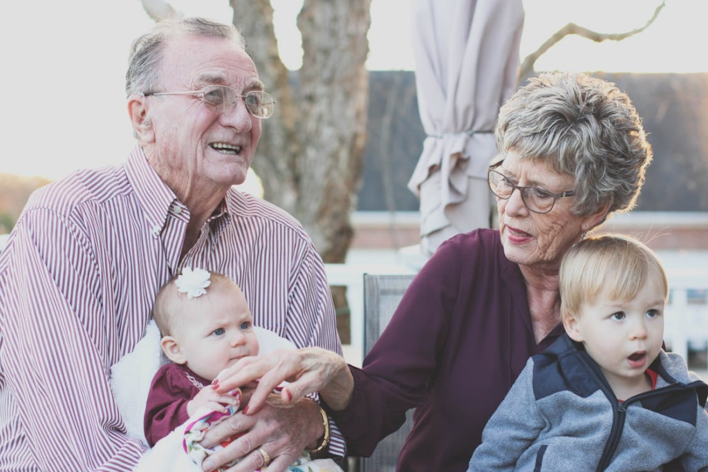 Grandparents and children sharing a moment in the park