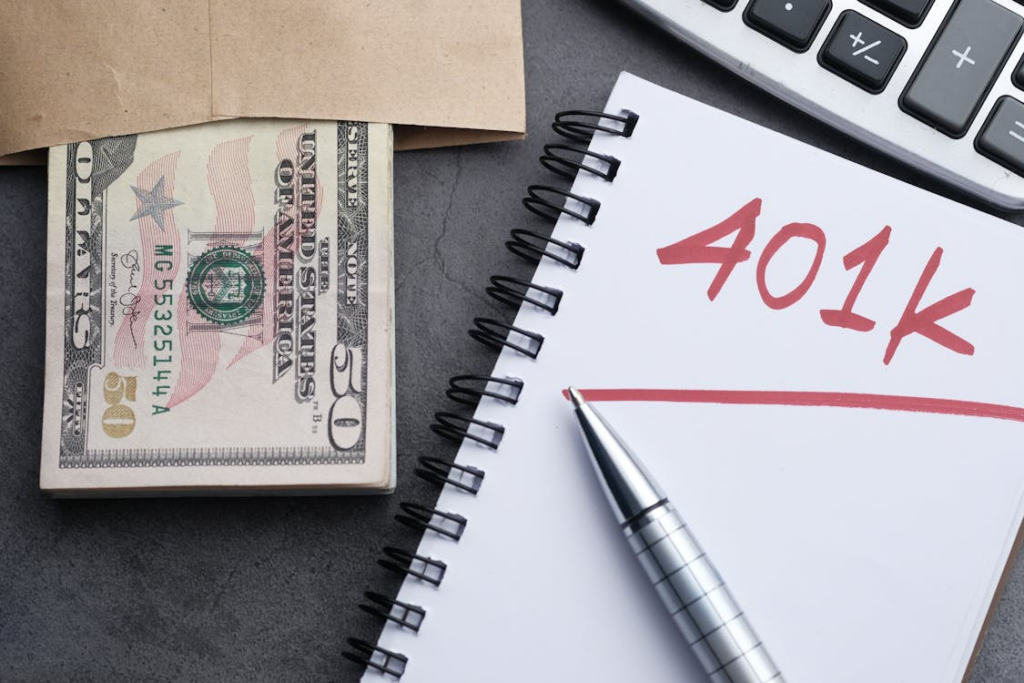 A notebook next to an envelope with money