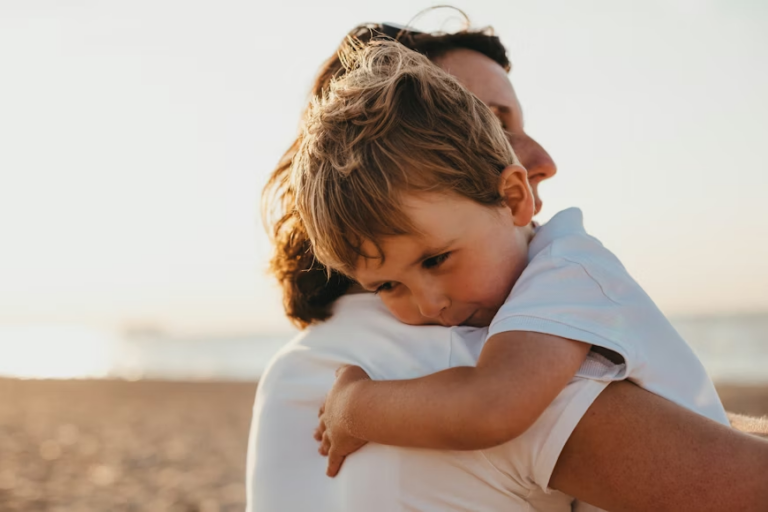 A parent hugging their child