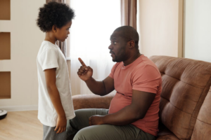 A parent scolding their child