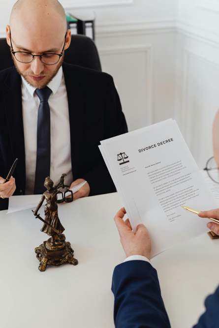 Attorney reviewing marital asset documents during a Texas divorce property division case