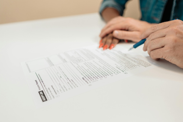 Parent reviewing legal paperwork related to unpaid child support enforcement in the Texas family court