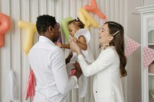 A parent giving baby to another parent