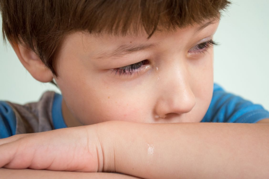 close-up of a boy crying
