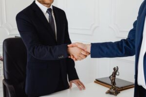 A lawyer shaking hands with a client