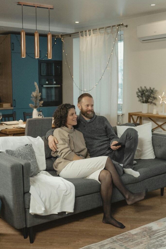 A couple watching TV together