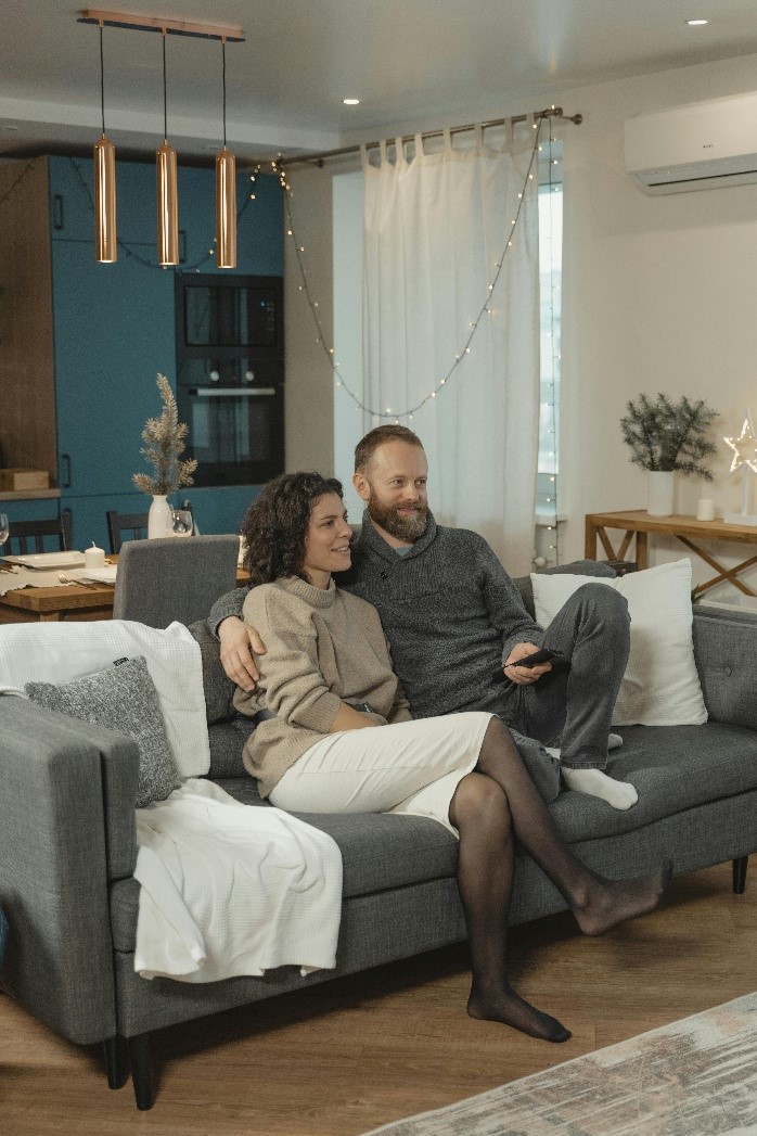 A couple watching TV together