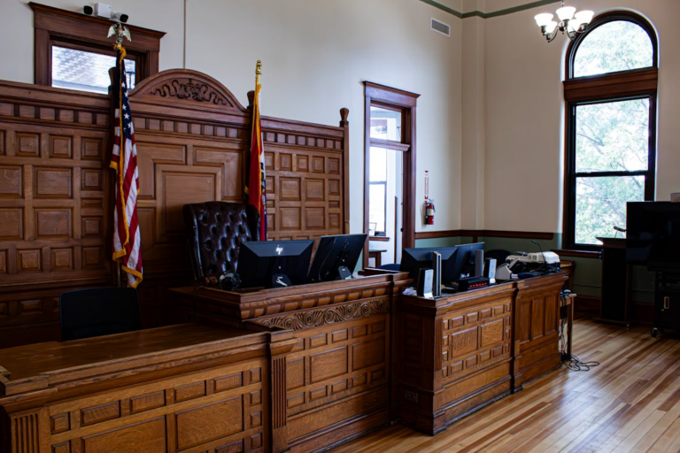 A courtroom with US flags