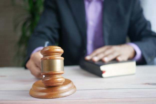 A person holding a gavel