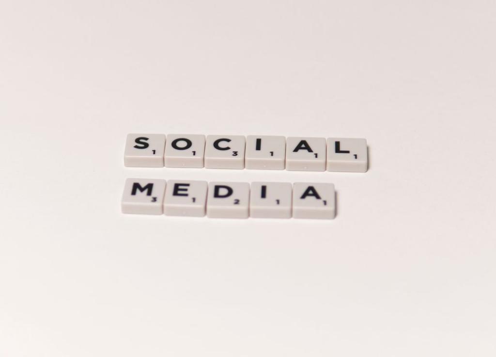 scrabble tiles spelling “social media”
