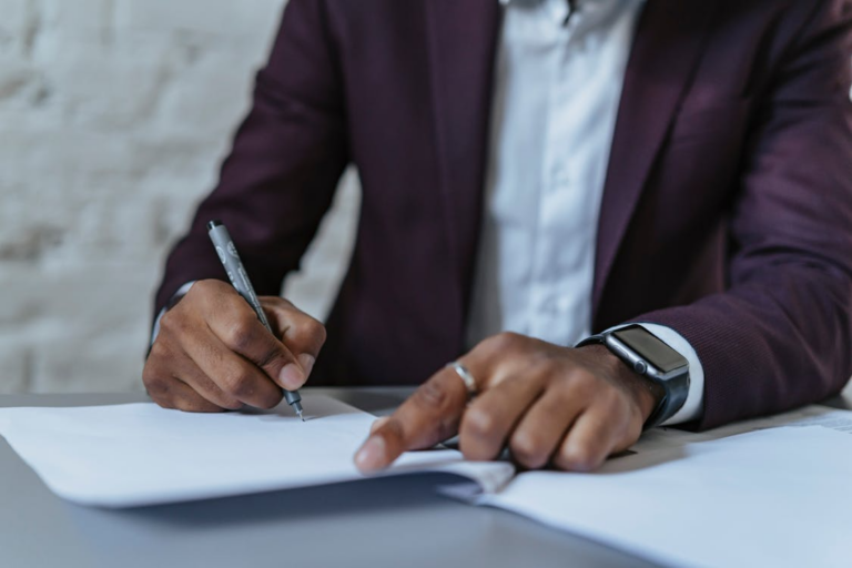 A person filling out paperwork