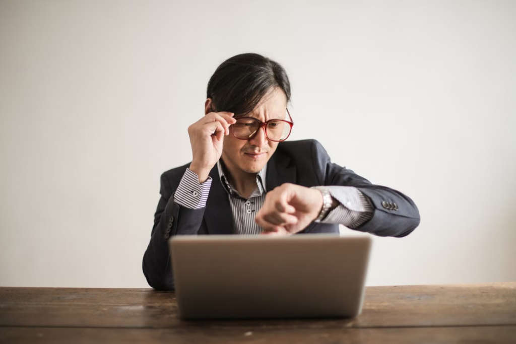 This image shows a person checking the time on a wristwatch.