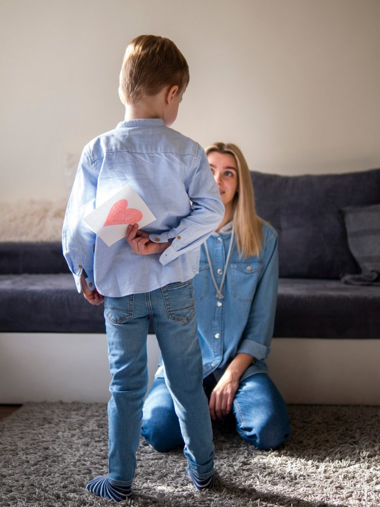 A kid holding a piece of paper