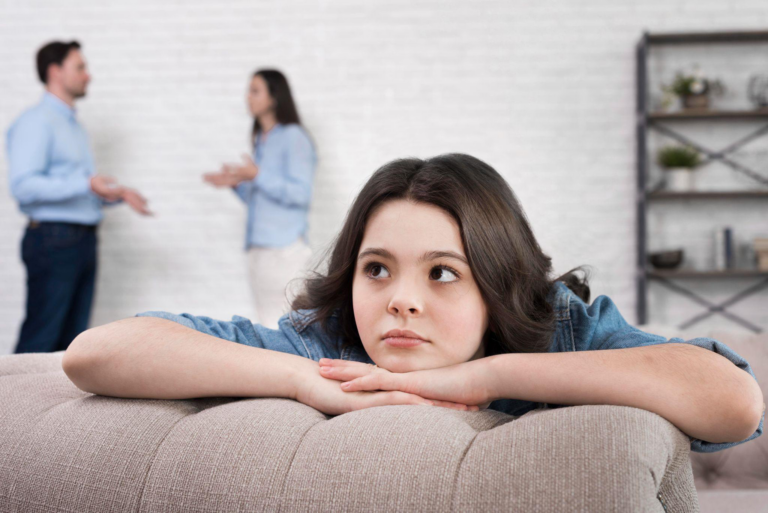 A couple arguing in front of their kid