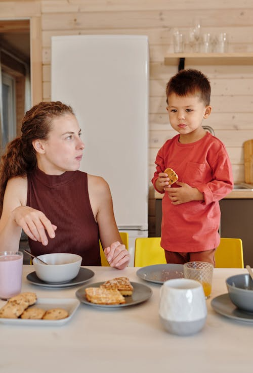 Mother and son having breakfast
