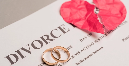Two rings placed on a divorce decree