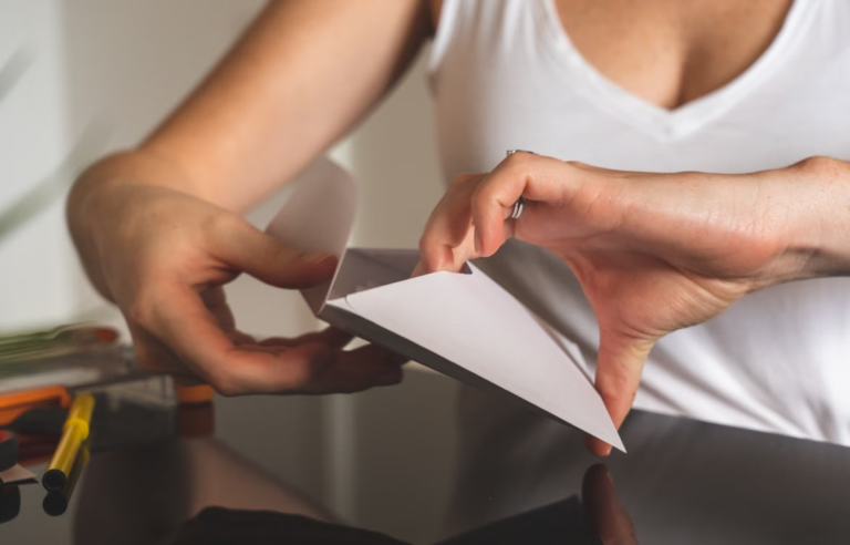 Person holding a sealed envelope representing service of divorce papers in Texas.