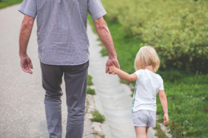 a child walking with their parent