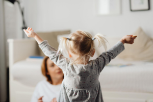  a small child running to her mother