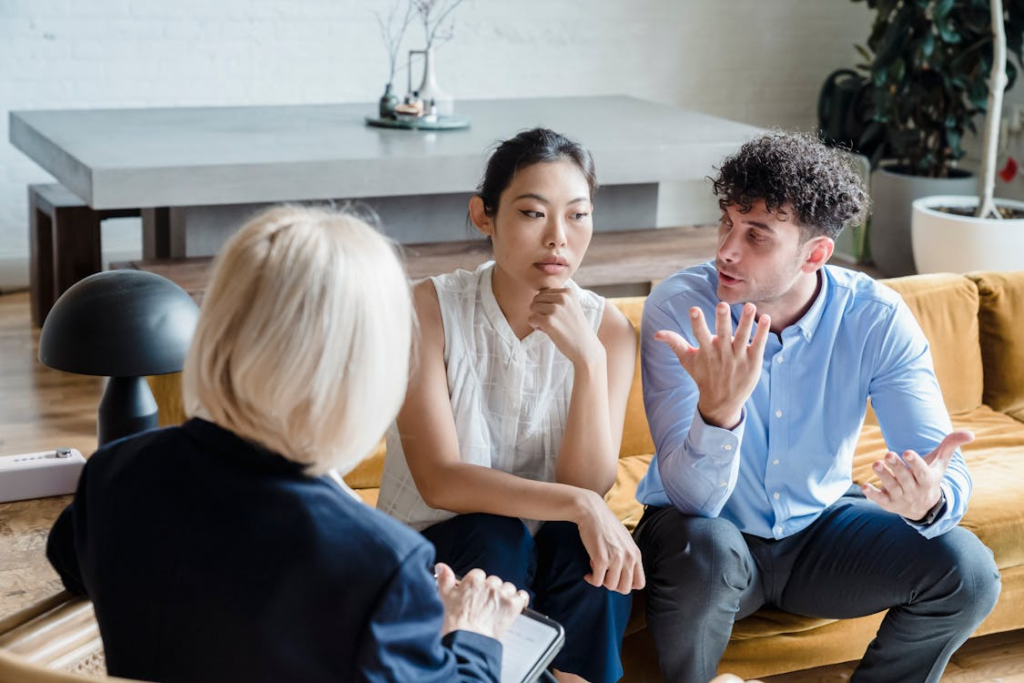 Pair consulting a Houston family law mediation attorney during a dispute session.