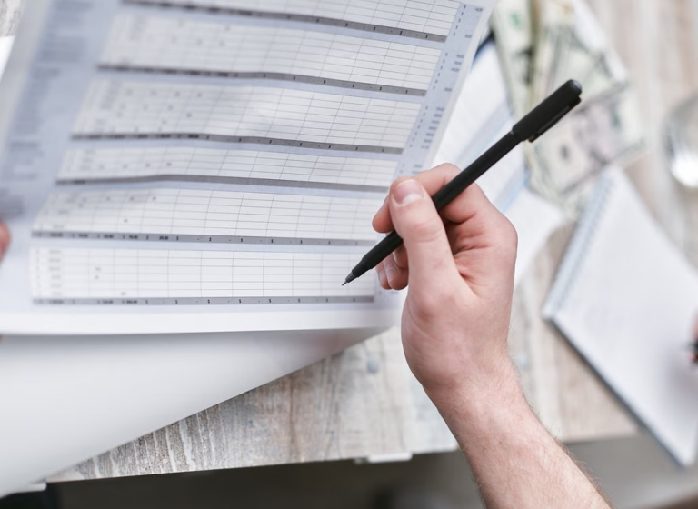 Person reviewing a financial document as evidence in a contested divorce case