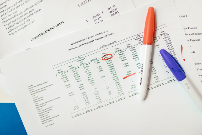 a financial statement marked with a red marker