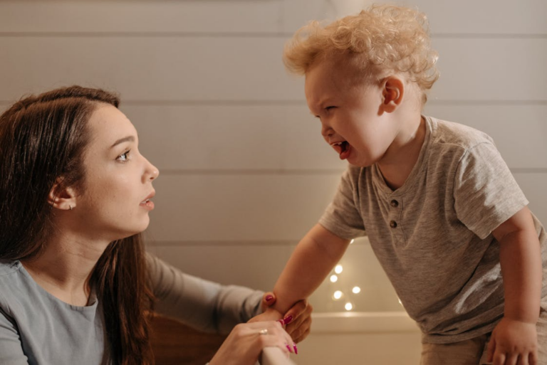 a son crying in front of his mother