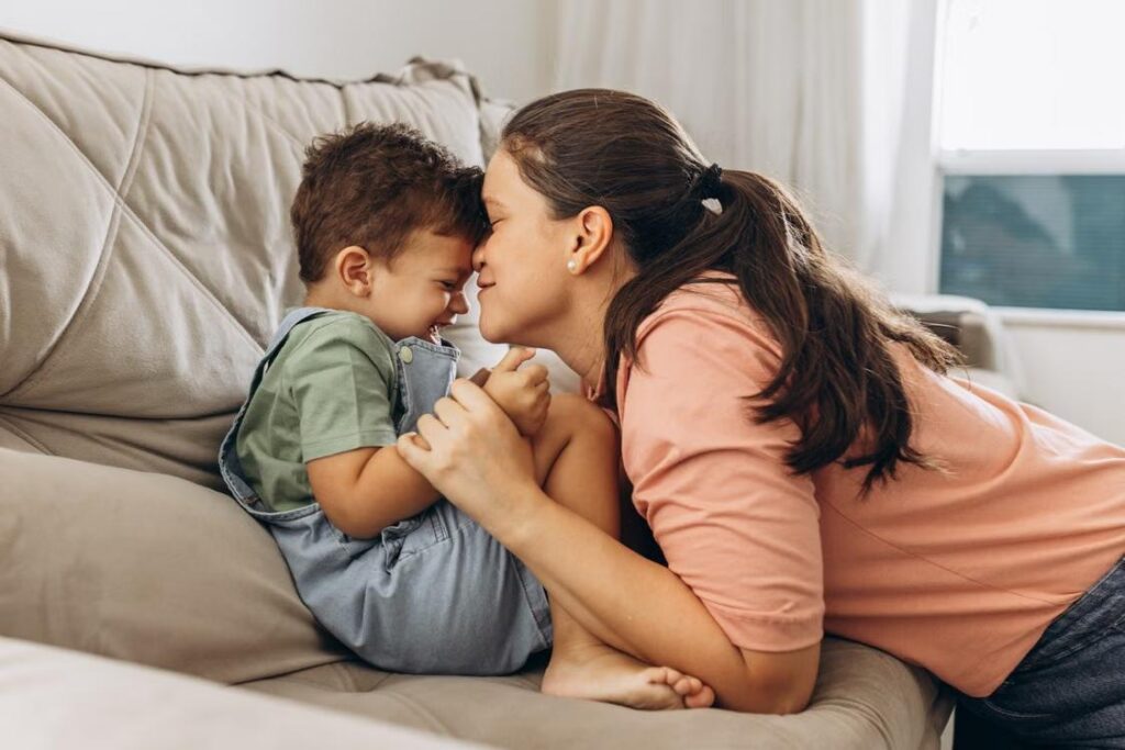 a mother being affectionate towards her son