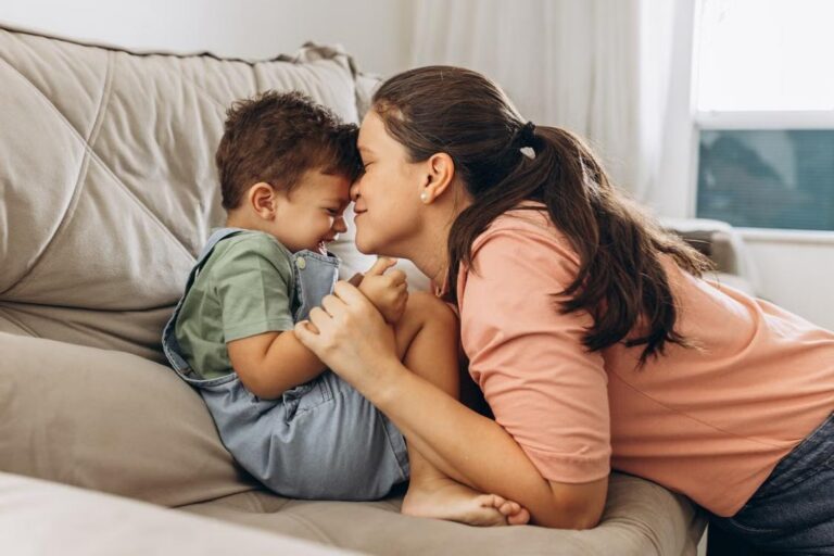 a mother being affectionate towards her son