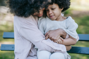 a parent comforting a child