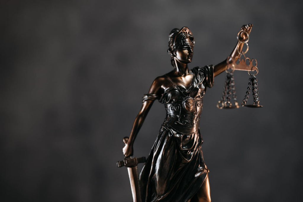 Lady Justice statue with scales representing Texas child custody court decisions